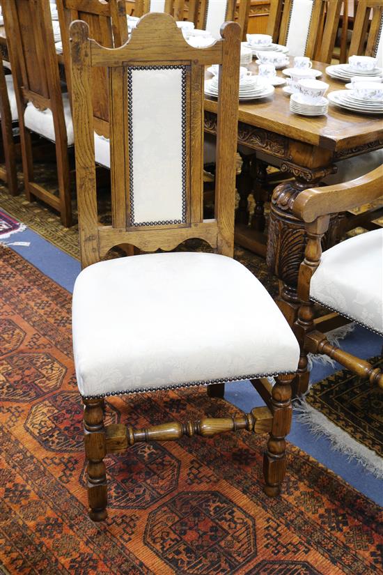 A set of 12 17th century style oak dining chairs